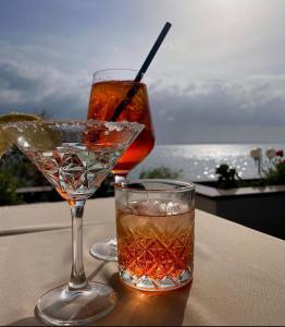 a drink sitting on a table next to a glass at Villa Nico in Zadar