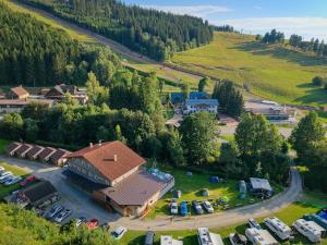 an aerial view of a building with a parking lot at Penzion Zákoutí Deštné v Orlických horách in Deštné v Orlických horách