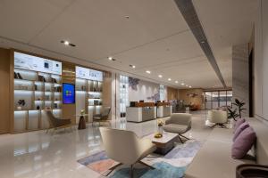 Posezení v ubytování ELong Hotel 艺 龙 酒 店 - Guilin Elephant Trunk Hill Scenic Area Two Rivers and Four Lakes Branch