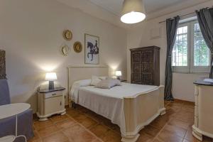 Ένα ή περισσότερα κρεβάτια σε δωμάτιο στο Villa Castelluccio Noto con piscina +22 φωτογραφίες