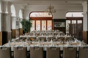 a large room with tables and chairs in it at Duna Wellness Hotel in Baja