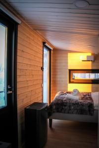 Ένα ή περισσότερα κρεβάτια σε δωμάτιο στο Palas Experience Olkkajärvi Resort