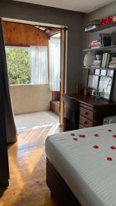 Ένα ή περισσότερα κρεβάτια σε δωμάτιο στο Chalé com jacuzzi