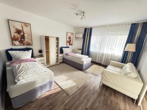 Postel nebo postele na pokoji v ubytování Ferienwohnungen Traubeneiche + 82 fotografií