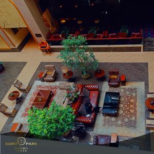 a model of a living room with furniture and plants at Euro Park Otel in Istanbul