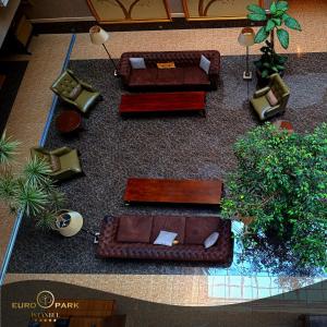 an overhead view of a living room with couches and plants at Euro Park Otel in Istanbul