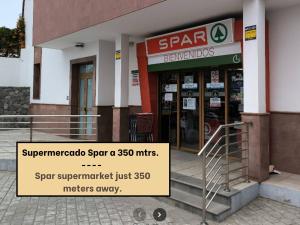 a store with a sign in front of it at Living Artenara - EARTH Adults Only in Artenara