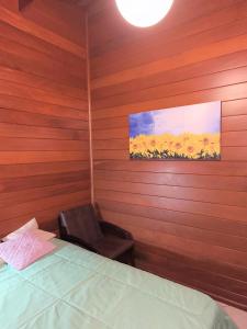 En eller flere senge i et værelse på Quarto com cama de casal - Florianópolis