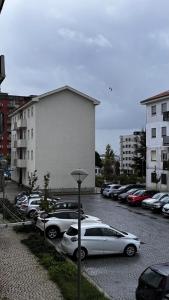 a group of cars parked in a parking lot at The Travellers Den in Matosinhos