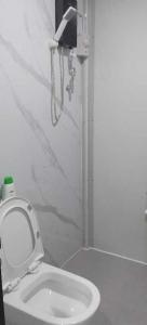 a bathroom with a white toilet in a room at Nadi friendly Apartment --2 bedroom in Nadi