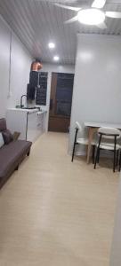 a room with a couch and a table and chairs at Nadi friendly Apartment --2 bedroom in Nadi +14 photos