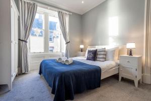 Ένα ή περισσότερα κρεβάτια σε δωμάτιο στο Norloch Cottage - Elie