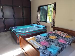 Postel nebo postele na pokoji v ubytování Shree Mata Homestay -South Goa & Karwar -Upto 15 Guests