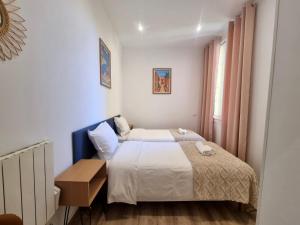 Ένα ή περισσότερα κρεβάτια σε δωμάτιο στο Jules Ferry Monaco