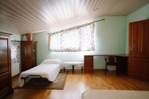a room with two beds and a window in it at Casa Rural Álvarez in Caravaca de la Cruz +103 photos