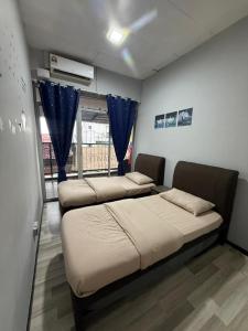 Ένα ή περισσότερα κρεβάτια σε δωμάτιο στο Zero Gravity Homestay 零重力民宿