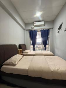 Ένα ή περισσότερα κρεβάτια σε δωμάτιο στο Zero Gravity Homestay 零重力民宿