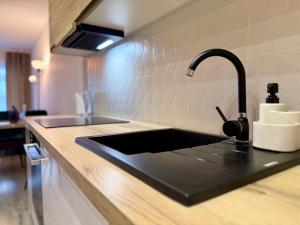 Η κουζίνα ή μικρή κουζίνα στο Prywatny Parking Cozy Place by Rentoom