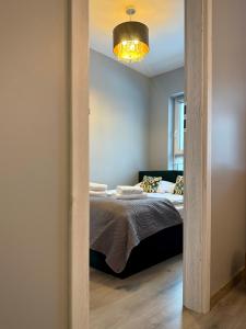 Ένα ή περισσότερα κρεβάτια σε δωμάτιο στο Prywatny Parking Cozy Place by Rentoom