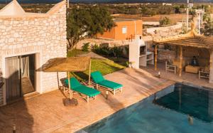 an aerial view of a villa with a swimming pool at Igiwano guest house in Essaouira
