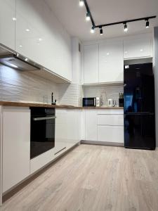 Η κουζίνα ή μικρή κουζίνα στο Prywatny Parking Charming Place by Rentoom