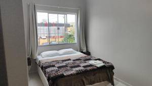 Ένα ή περισσότερα κρεβάτια σε δωμάτιο στο Hotel Guarany