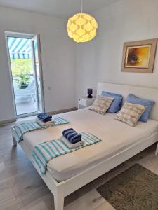 Ένα ή περισσότερα κρεβάτια σε δωμάτιο στο App Sanny with nice terrace