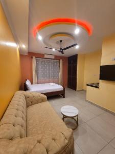 a living room with a couch and a bed at Seko Haven Resort in Kilifi