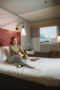 Ένα ή περισσότερα κρεβάτια σε δωμάτιο στο ibis Juazeiro do Norte