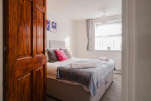 Ένα ή περισσότερα κρεβάτια σε δωμάτιο στο Comfortable home away from home