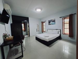 Postel nebo postele na pokoji v ubytování Cocoloco bungalow