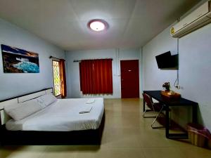 Ένα ή περισσότερα κρεβάτια σε δωμάτιο στο Cocoloco bungalow