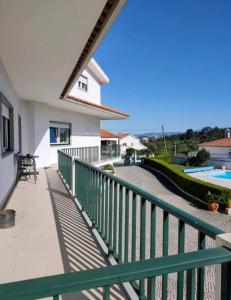 a balcony of a house with a swimming pool at Vergikosk House - villa 4 quartos com piscina privada in Bombarral +9 photos