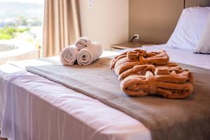 Ένα ή περισσότερα κρεβάτια σε δωμάτιο στο Experiência Romântica com Jacuzzi Privativa, a Melhor Vista do Mar e do Porto