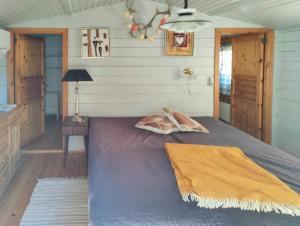 Кровать или кровати в номере Cozy Cottage Close To Thy National Park