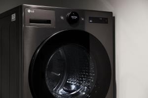 a washing machine with its door open in a room at Morf Stay in Seoul
