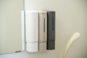 a shelf with three white and black appliances at yadobankharuyoshi201 in Fukuoka