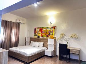 Ένα ή περισσότερα κρεβάτια σε δωμάτιο στο Ogidi studios