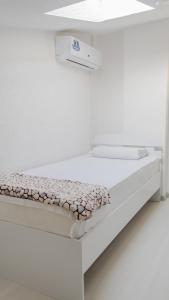 Ένα ή περισσότερα κρεβάτια σε δωμάτιο στο VD Apartment