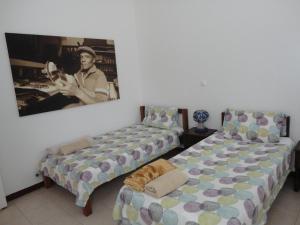 Postel nebo postele na pokoji v ubytování Música do Mar
