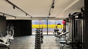 a gym with treadmills and machines in a room at SOlaz Smart Living Manaira in João Pessoa