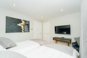 Ένα ή περισσότερα κρεβάτια σε δωμάτιο στο Eagleside Apartments