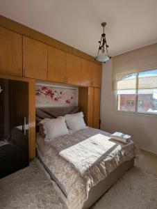 Ένα ή περισσότερα κρεβάτια σε δωμάτιο στο Appartement à 5 min de la plage, piscine et parking privé