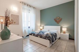 Giường trong phòng chung tại I Lavatoi Iseo - apartment