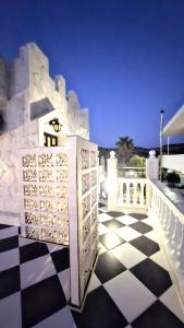 a black and white checkered floor on a house at Castellino Studios in Faliraki