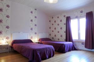 Postel nebo postele na pokoji v ubytování Le paradis des abeilles