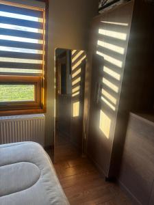 Ένα ή περισσότερα κρεβάτια σε δωμάτιο στο Casa Natales- Patagonia House