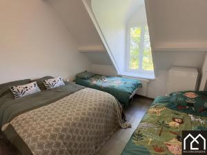 Ένα ή περισσότερα κρεβάτια σε δωμάτιο στο L'Echapée Belle du Mont Lambert