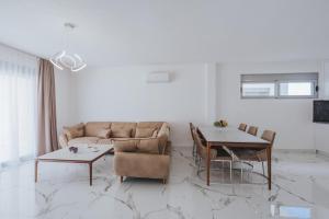 a living room with a couch and a table at Villa Anida in Ulcinj