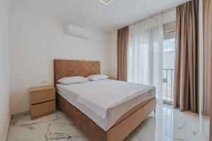 a bedroom with a bed and a large window at Villa Anida in Ulcinj +43 photos